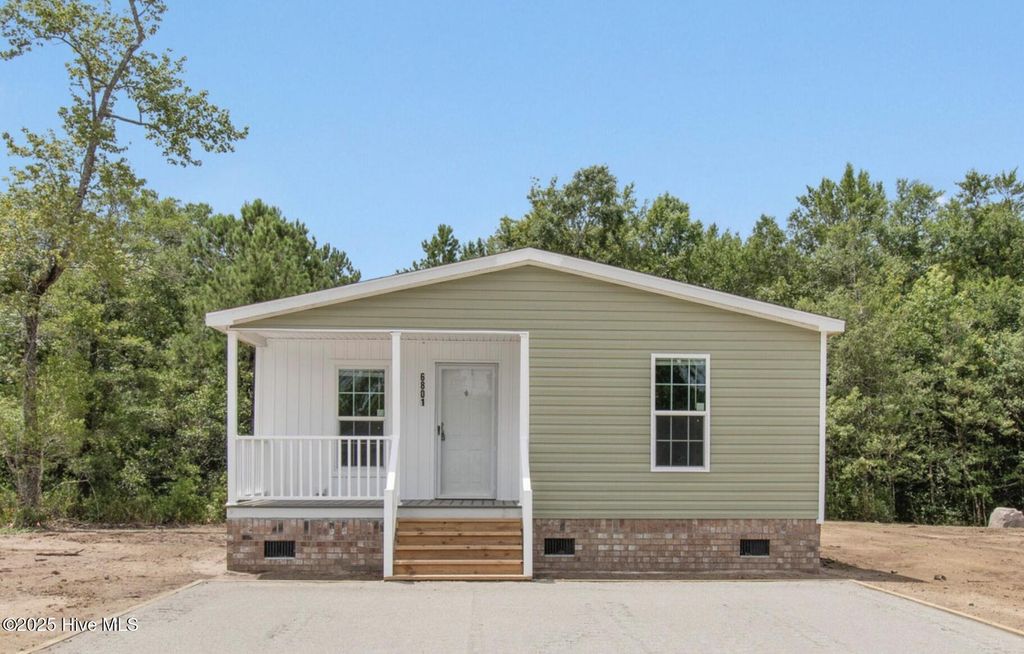 Photo of 6801 Lewis Drive SE, Winnabow, NC 28479 (MLS # 100541882)