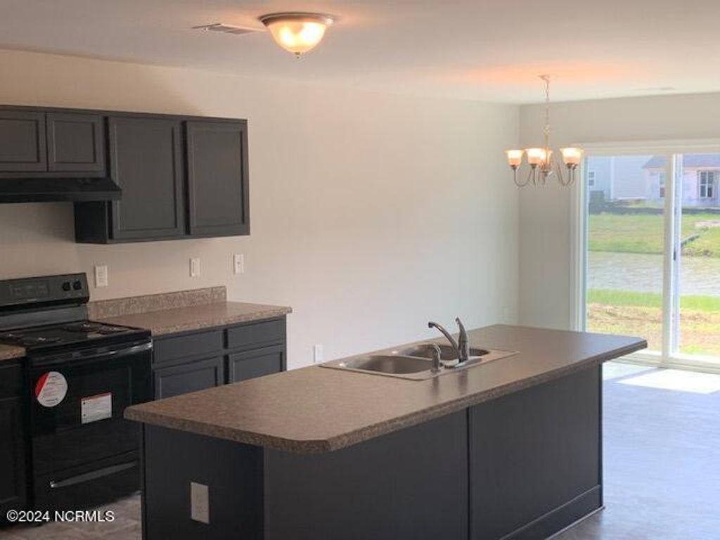 Photo of 736 Landmark Cove, Carolina Shores, NC 28467 (MLS # 100519231)