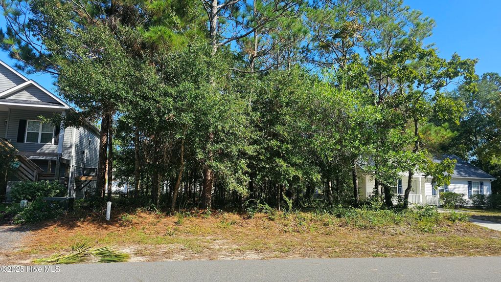 Photo of 142 NE 17th Street, Oak Island, NC 28465 (MLS # 100536370)
