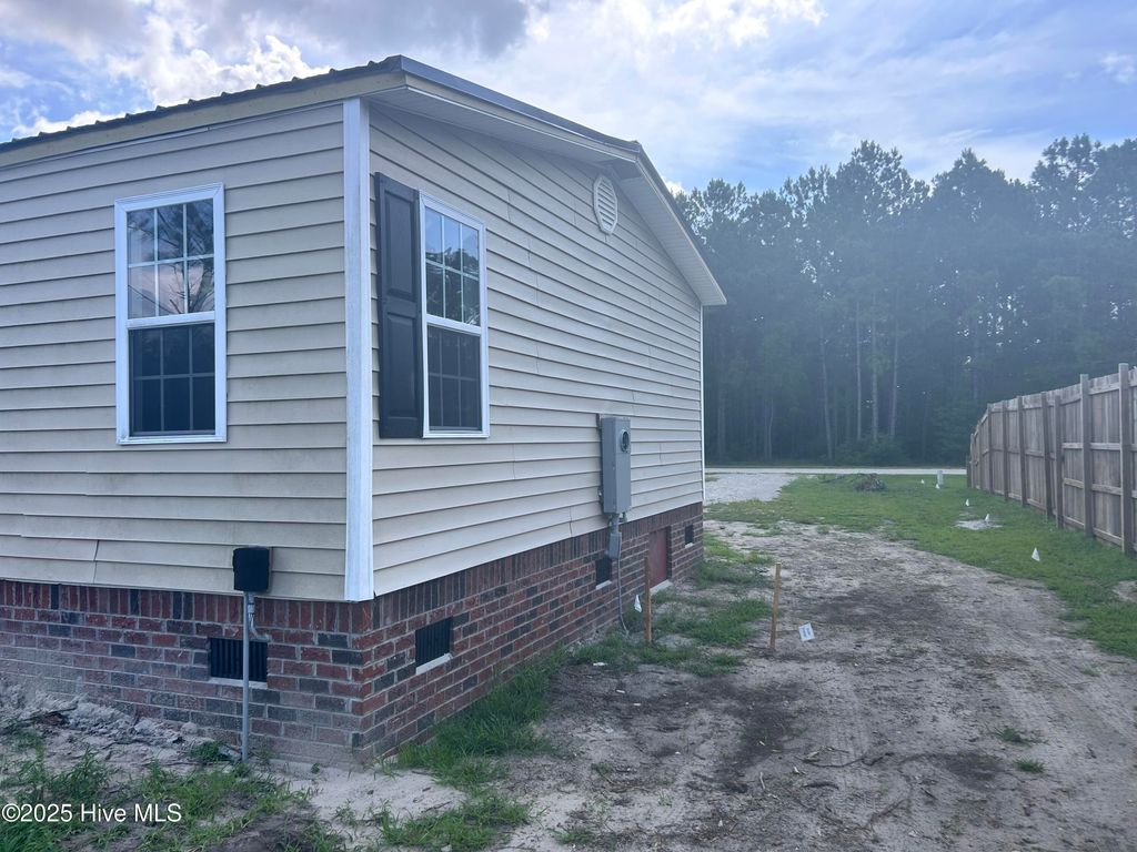 Photo of 383 Woodside Drive, Hampstead, NC 28443 (MLS # 100521772)