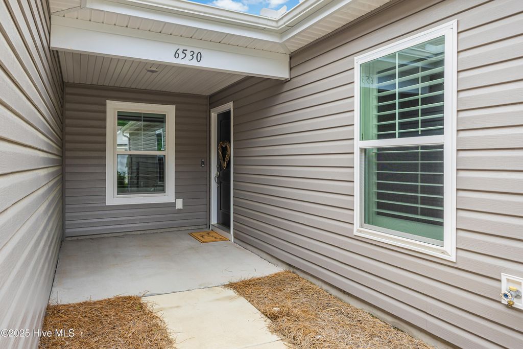 Photo of 6530 Green Fennel Avenue SW, Ocean Isle Beach, NC 28469 (MLS # 100511637)