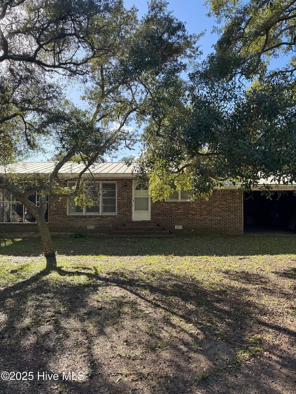 Photo of 309 Womble Street, Oak Island, NC 28465 (MLS # 100534726)