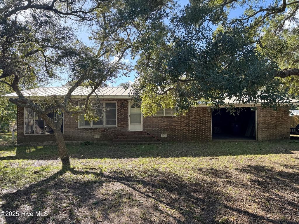 Photo of 309 Womble Street, Oak Island, NC 28465 (MLS # 100534726)