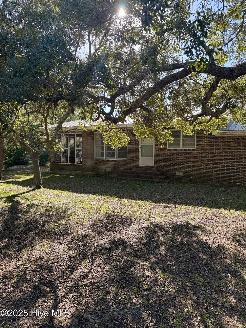 Photo of 309 Womble Street, Oak Island, NC 28465 (MLS # 100534726)