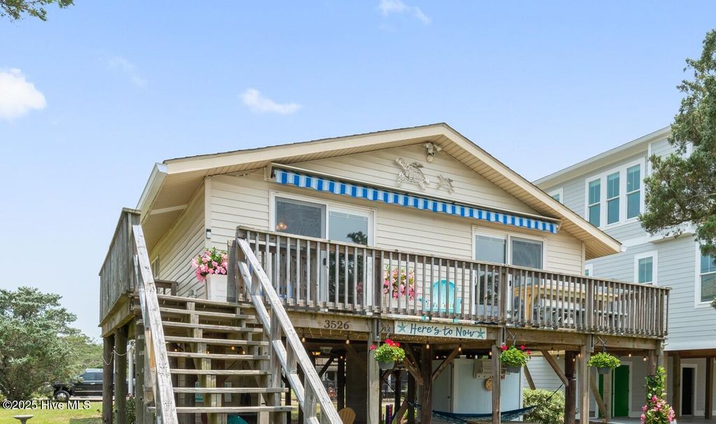 Photo of 3526 E Dolphin Drive, Oak Island, NC 28465 (MLS # 100520614)