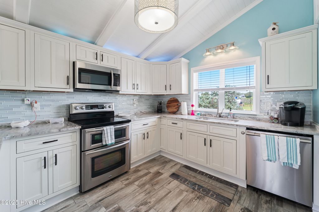 Photo of 3526 E Dolphin Drive, Oak Island, NC 28465 (MLS # 100520614)