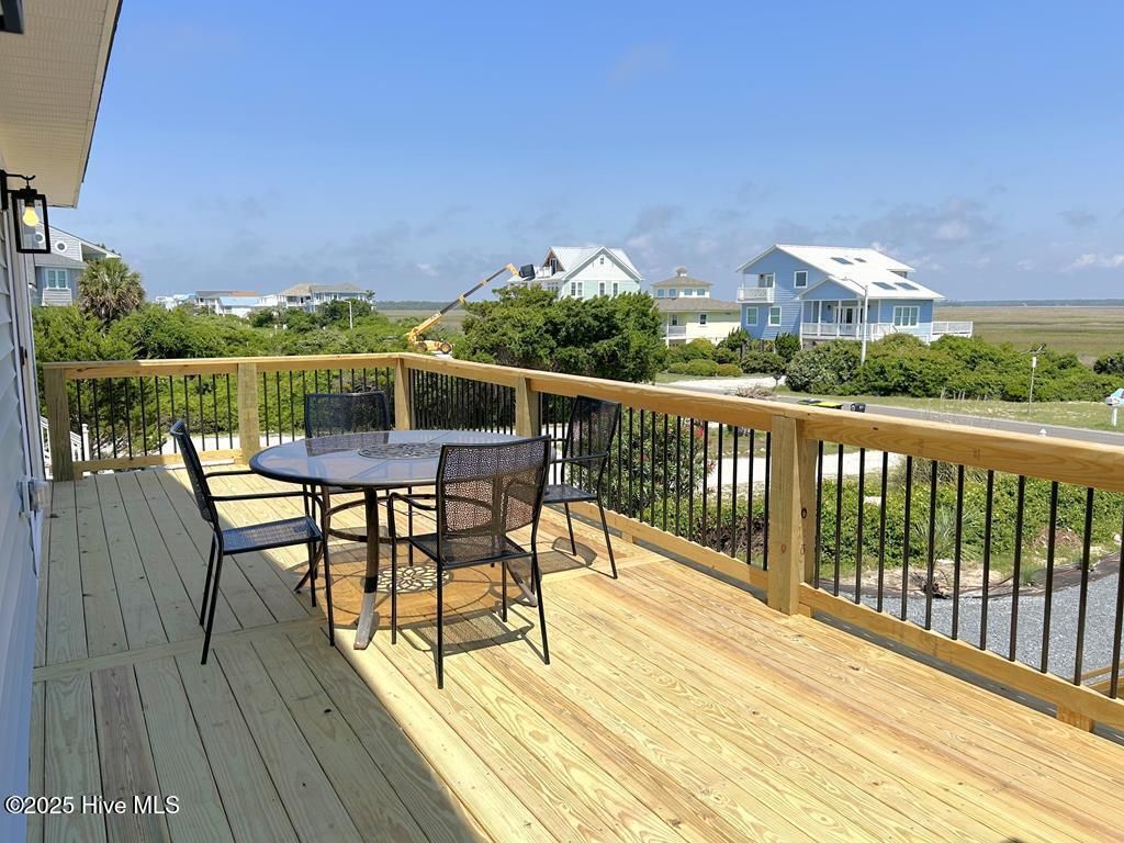 Photo of 323 Caswell Beach Road, Oak Island, NC 28465 (MLS # 100533817)