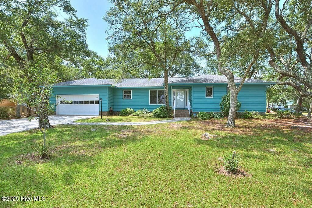 Photo of 103 Throckmorton Street, Oak Island, NC 28465 (MLS # 100522613)