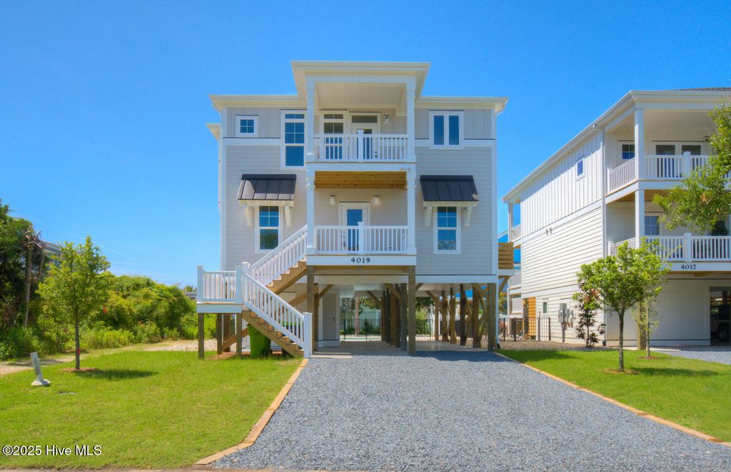 Photo of 4019 E Pelican Drive, Oak Island, NC 28465 (MLS # 100448702)