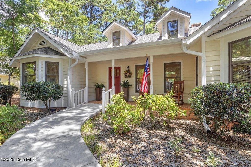 Photo of 119 Flowering Bridge Path, Caswell Beach, NC 28465 (MLS # 100516791)