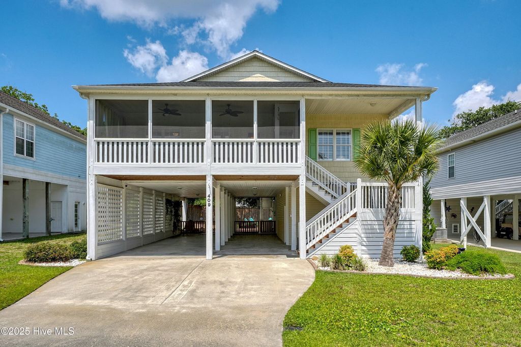 Photo of 409 Womble Street, Oak Island, NC 28465 (MLS # 100512389)