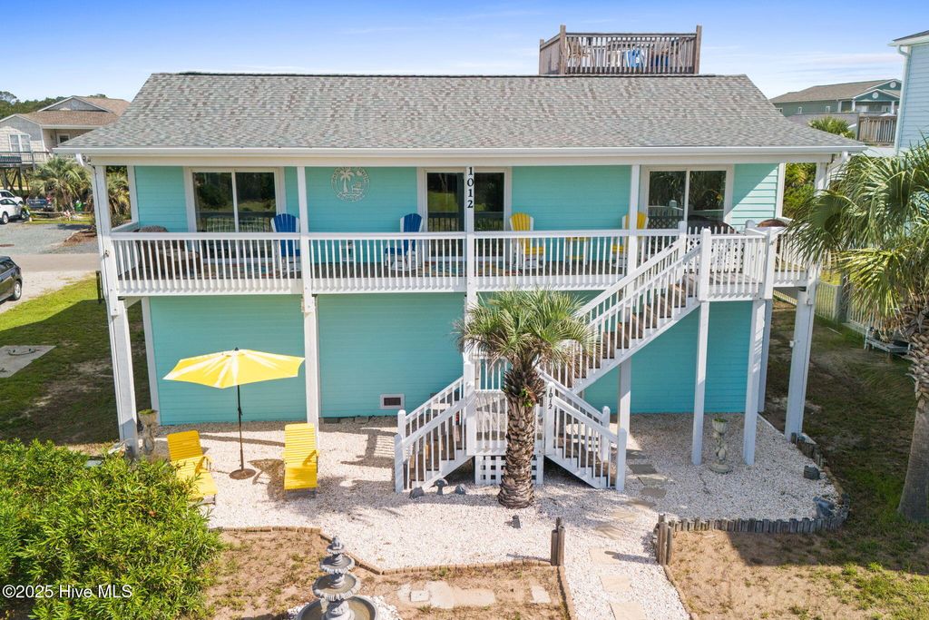 Photo of 1012 W Dolphin Drive, Oak Island, NC 28465 (MLS # 100527553)