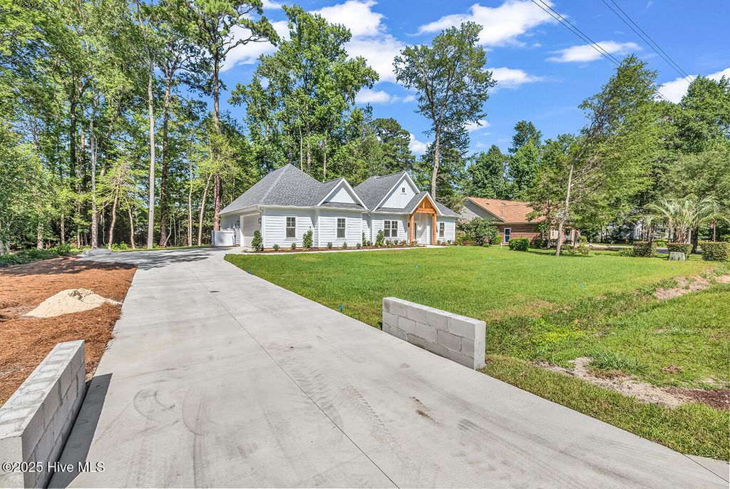 Photo of 25 Pinewood Drive, Carolina Shores, NC 28467 (MLS # 100502261)