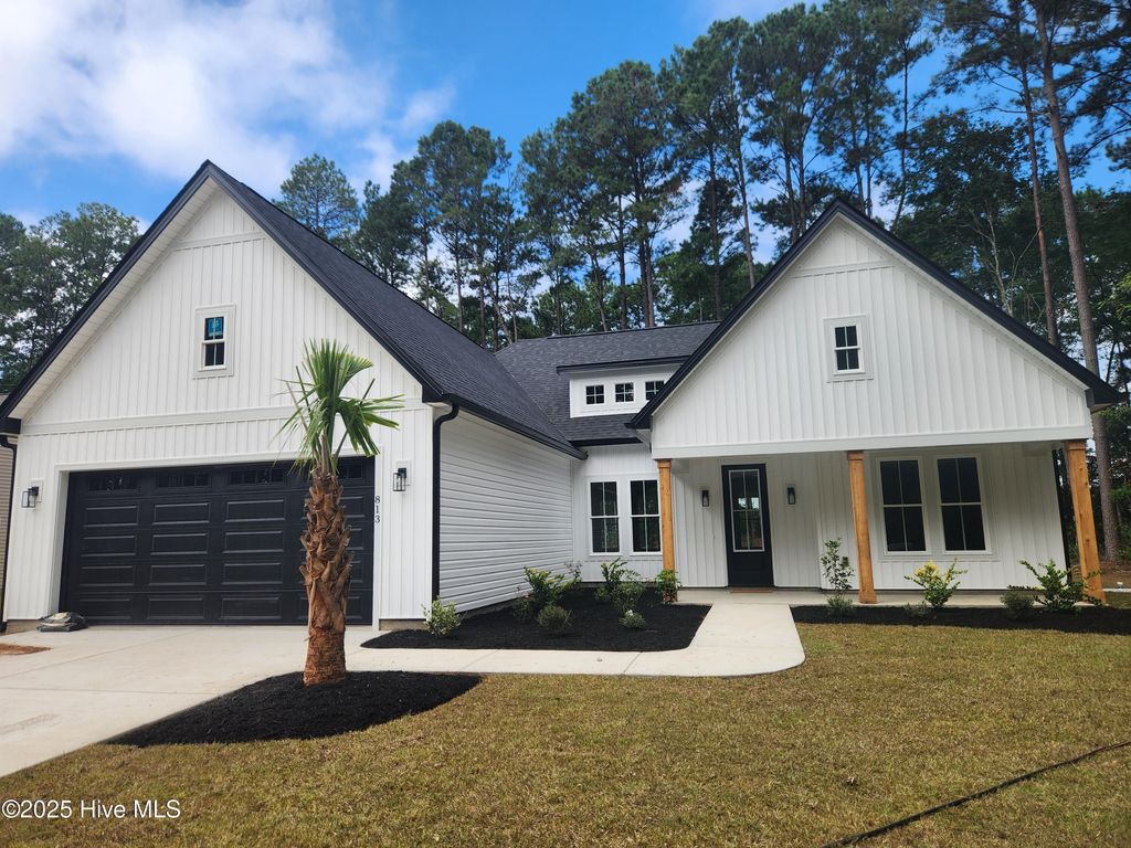 Photo of 813 Boundaryline Drive NW, Calabash, NC 28467 (MLS # 100529896)
