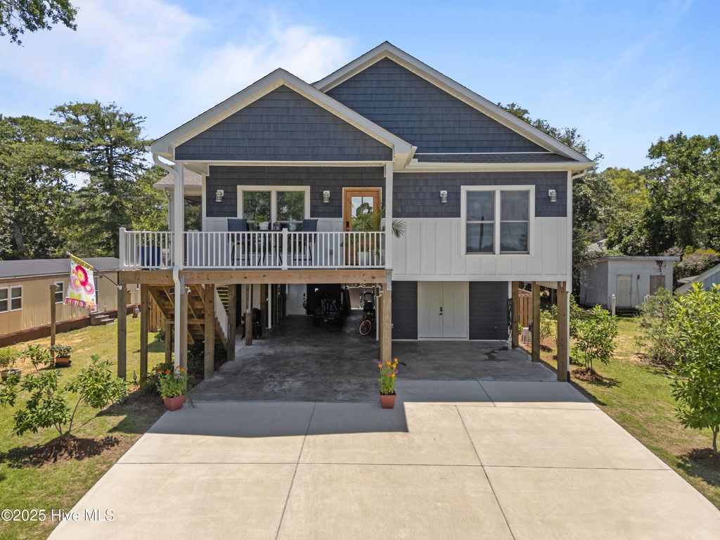 Photo of 7605 E Yacht Drive NE, Oak Island, NC 28465 (MLS # 100512524)