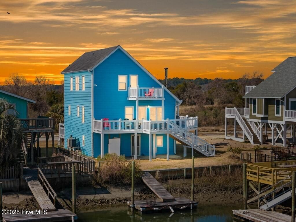 Photo of 154 Sand Dollar Street, Holden Beach, NC 28462 (MLS # 100507121)