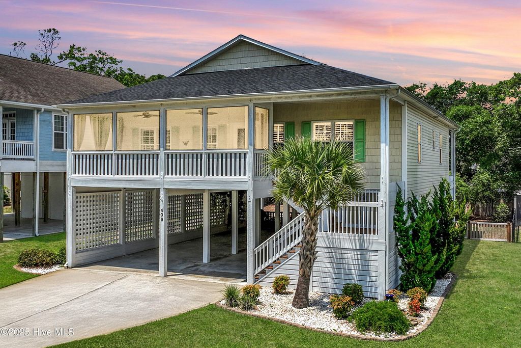 Photo of 409 Womble Street, Oak Island, NC 28465 (MLS # 100541336)