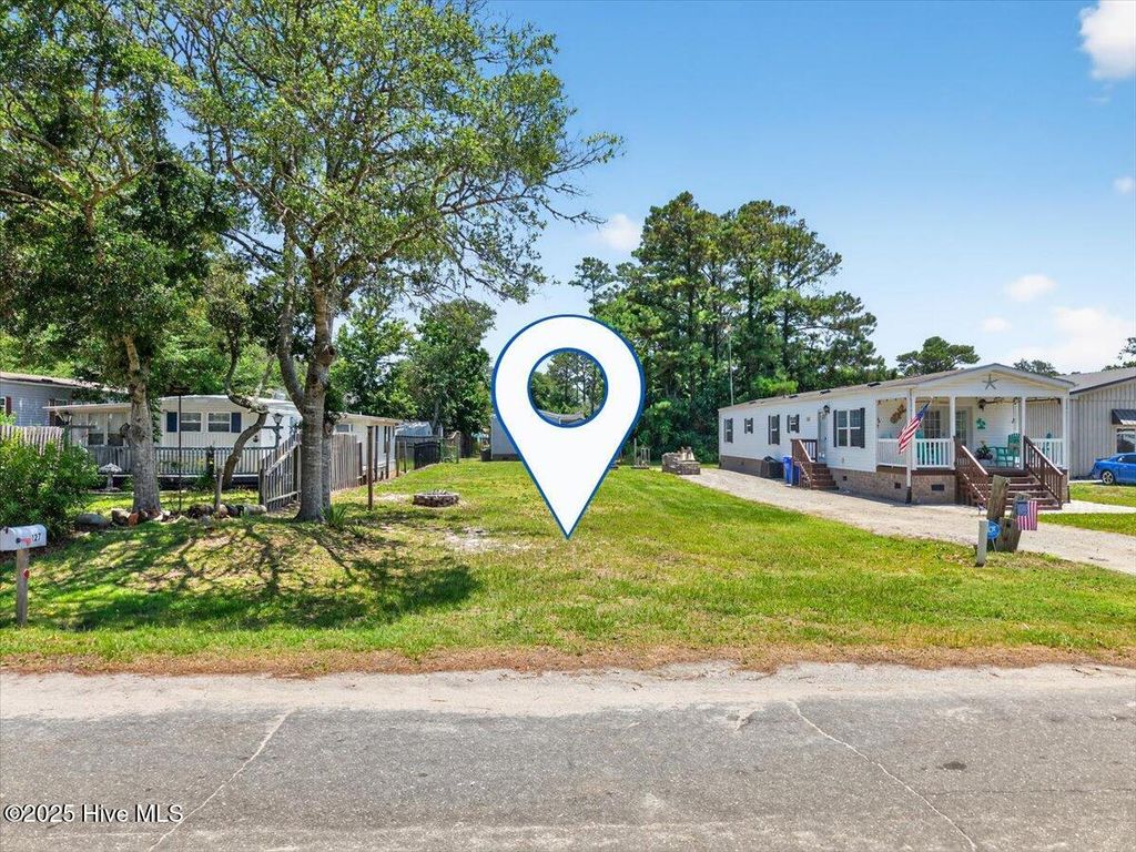 Photo of 130 NE 75th Street, Oak Island, NC 28465 (MLS # 100517582)