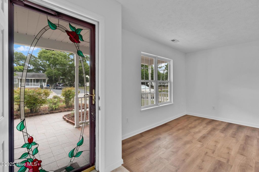 Photo of 161 NE 7th Street, Oak Island, NC 28465 (MLS # 100520698)