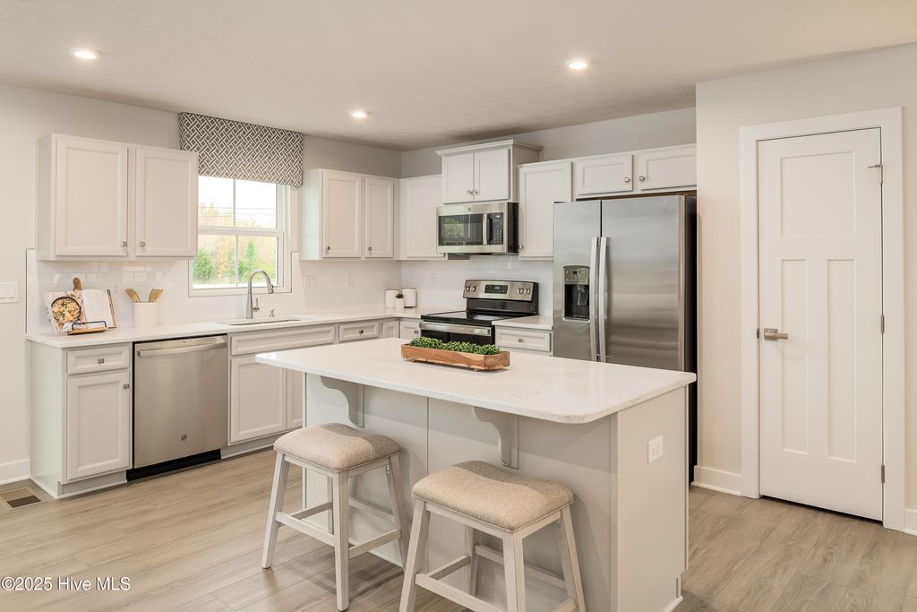 Photo of 4073 Farmfield Drive, Navassa, NC 28451 (MLS # 100527960)