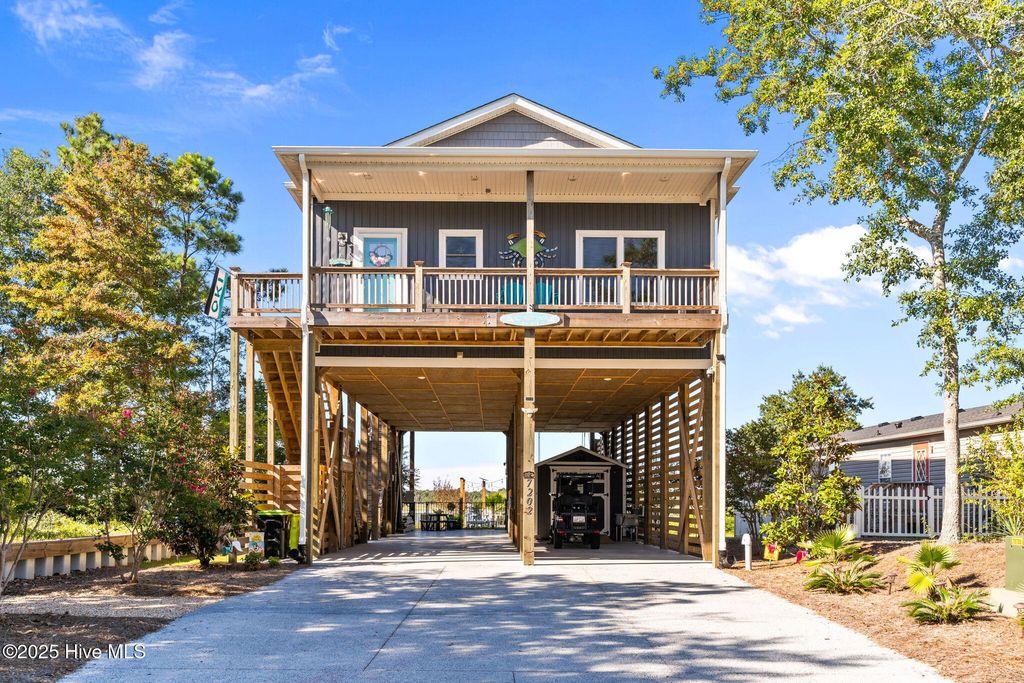 Photo of 7202 E Yacht Drive, Oak Island, NC 28465 (MLS # 100530778)