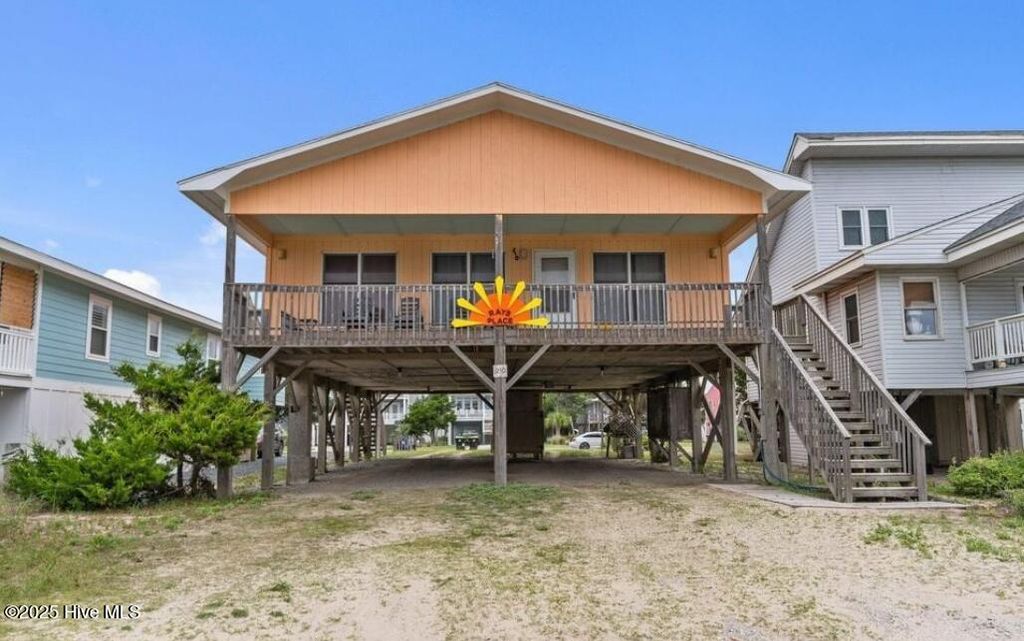 Photo of 210 W Beach Drive, Oak Island, NC 28465 (MLS # 100513901)