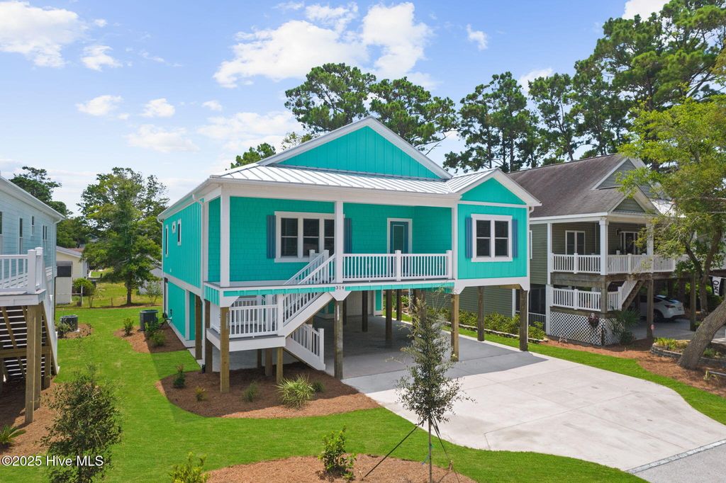 Photo of 228 NE 56th Street, Oak Island, NC 28465 (MLS # 100524435)