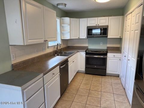 Tiny photo for 214 NE 54th Street, Oak Island, NC 28465 (MLS # 100538712)