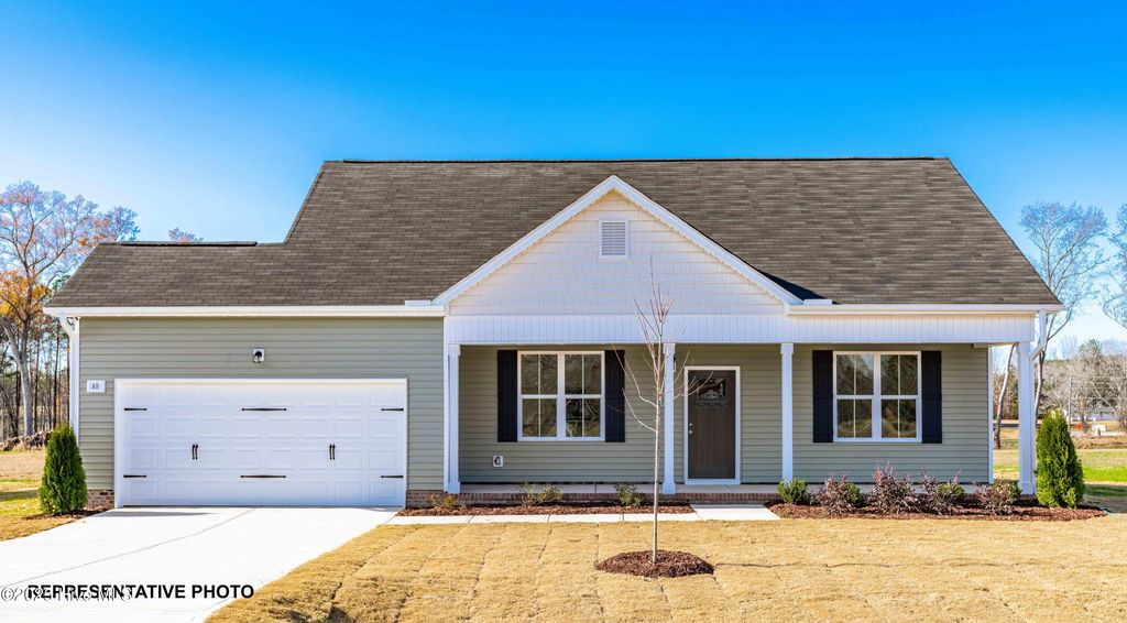 Photo of 633 Springtooth Drive, Zebulon, NC 27597 (MLS # 100527609)
