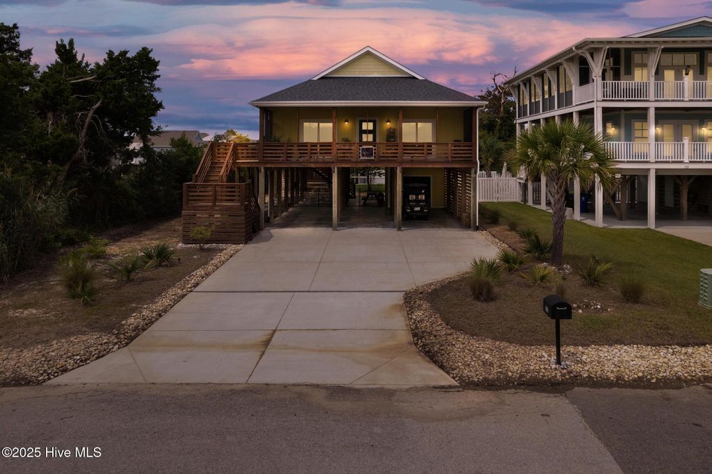 Photo of 115 SE 45th Street, Oak Island, NC 28465 (MLS # 100526882)