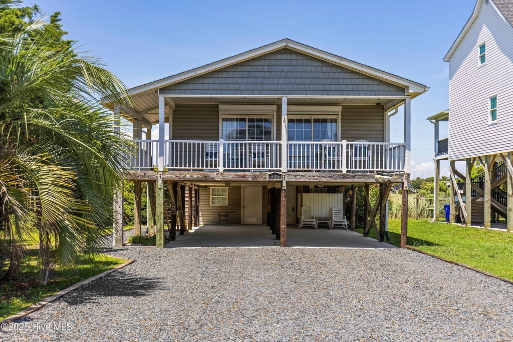 Photo of 316 E Dolphin Drive, Oak Island, NC 28465 (MLS # 100513587)