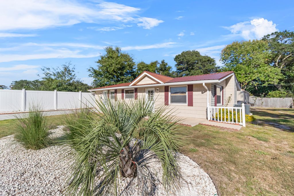 Photo of 314 Keziah Street, Oak Island, NC 28465 (MLS # 100533969)