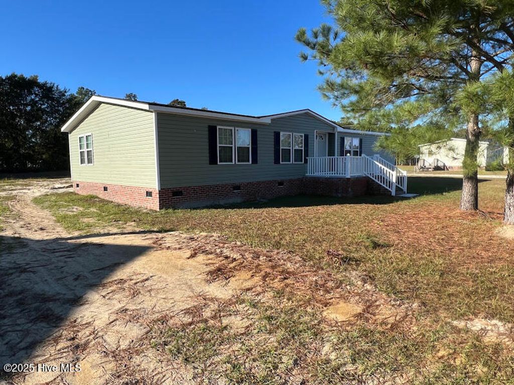 Photo of 542 Red Oak Farm Road, Tar Heel, NC 28392 (MLS # 100543225)