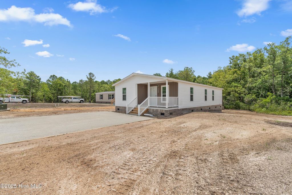 Photo of 6823 Lewis Drive SE, Winnabow, NC 28479 (MLS # 100482121)