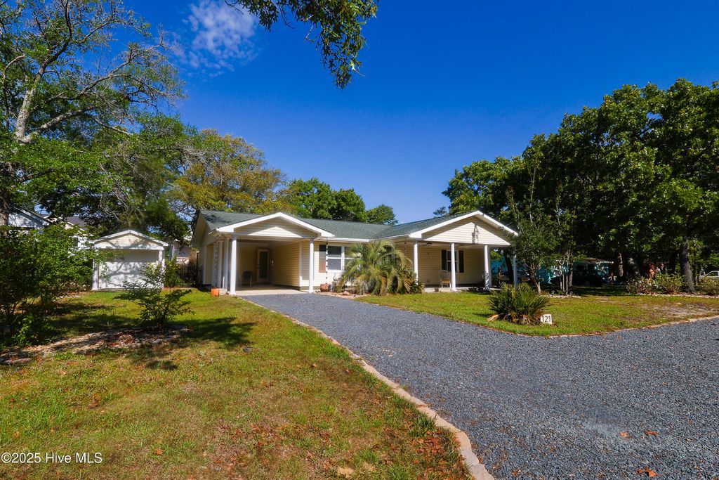 Photo of 121 NW 1st Street, Oak Island, NC 28465 (MLS # 100504444)