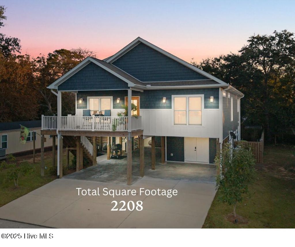 Photo of 7605 E Yacht Drive NE, Oak Island, NC 28465 (MLS # 100541754)