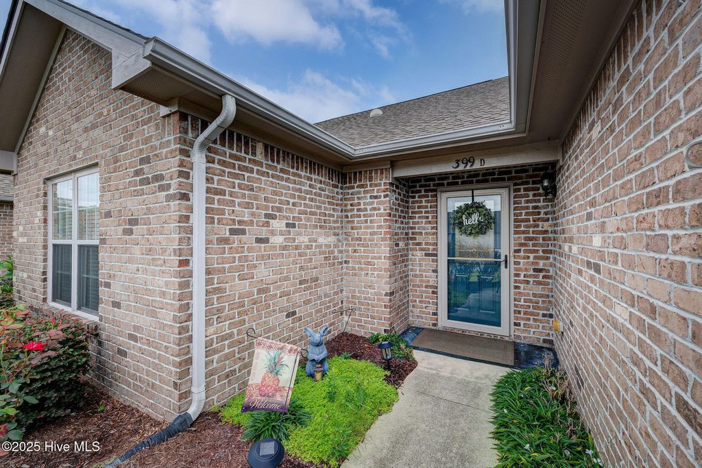 Photo of 399 Castle Bay Drive #D, Hampstead, NC 28443 (MLS # 100524701)