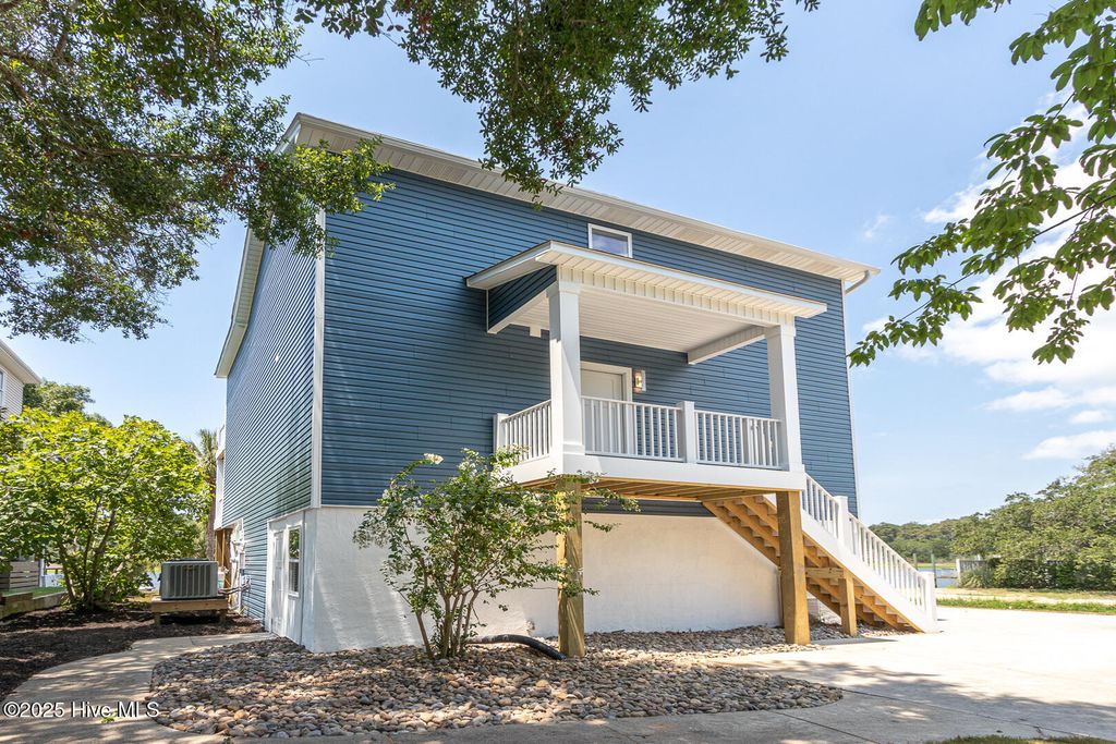 Photo of 102 SW Yacht Drive, Oak Island, NC 28465 (MLS # 100521409)