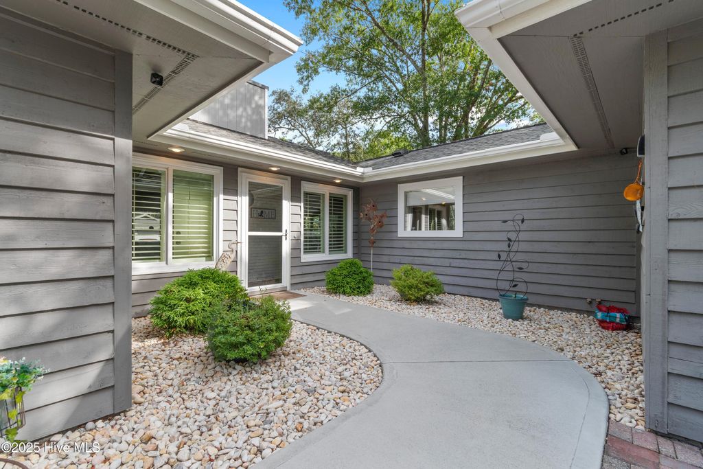 Photo of 606 Camellia Lane, Sunset Beach, NC 28468 (MLS # 100531544)