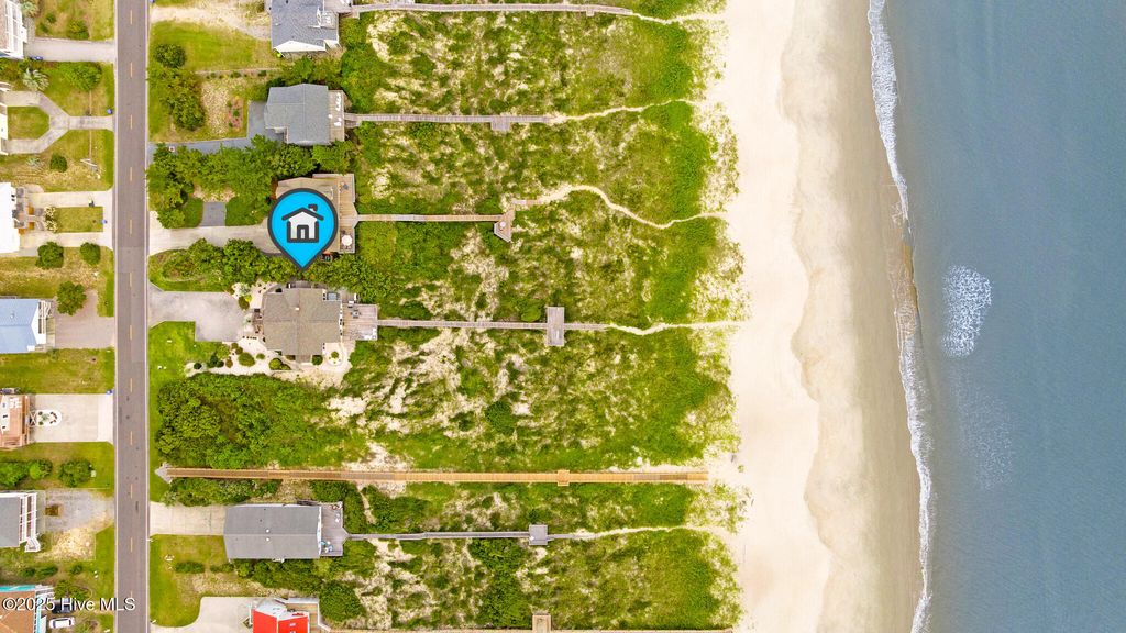 Photo of 419 Caswell Beach Road, Oak Island, NC 28465 (MLS # 100531510)