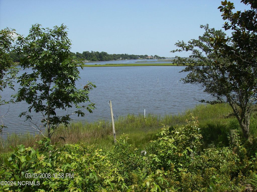 Photo of 135 E High Bluff Drive, Hampstead, NC 28443 (MLS # 100459074)
