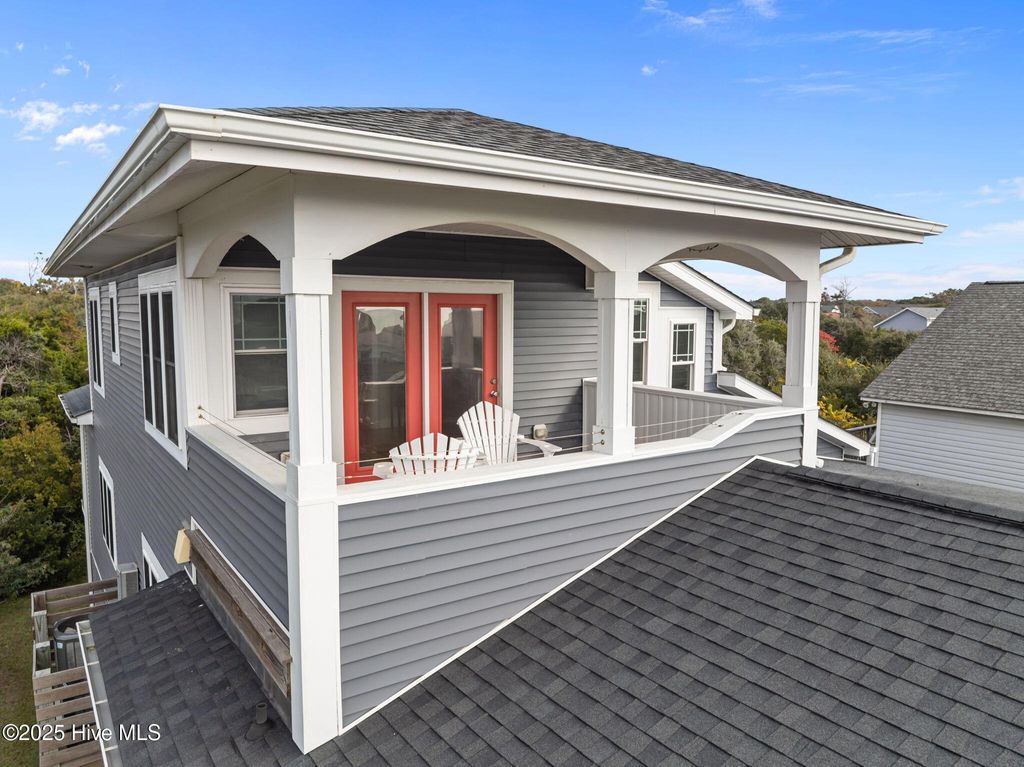 Photo of 1914 E Dolphin Drive, Oak Island, NC 28465 (MLS # 100541907)