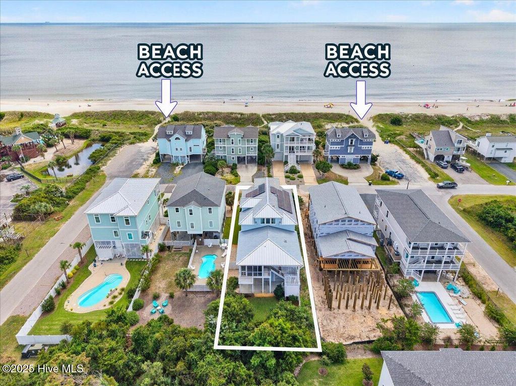 Photo of 7004 E Beach Drive, Oak Island, NC 28465 (MLS # 100530366)
