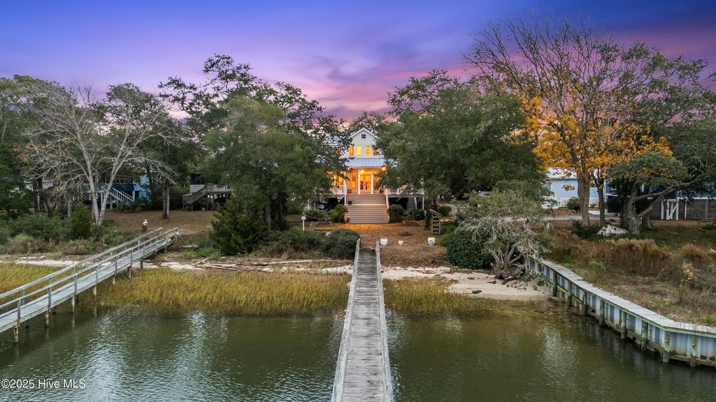 Photo of 116 SW Yacht Drive, Oak Island, NC 28465 (MLS # 100544140)