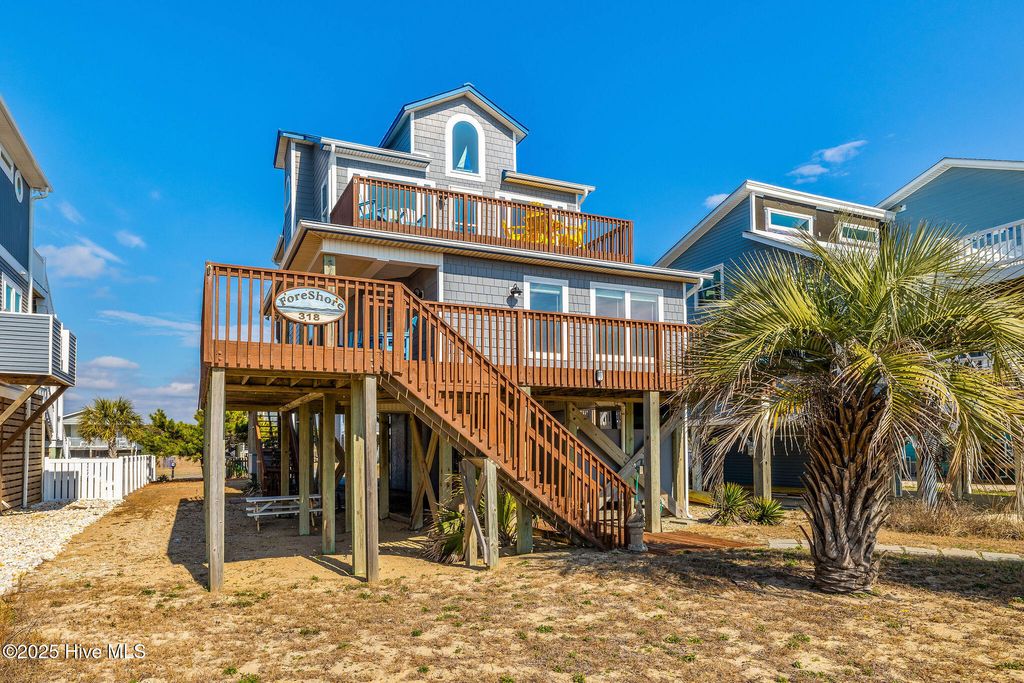 Photo of 318 E Beach Drive, Oak Island, NC 28465 (MLS # 100529088)
