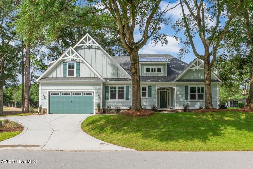 Photo of 394 Sea Trail Drive W, Sunset Beach, NC 28468 (MLS # 100528921)