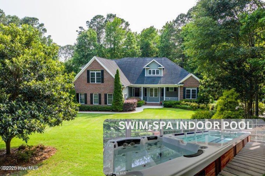 Photo of 120 E High Bluff Drive, Hampstead, NC 28443 (MLS # 100511410)