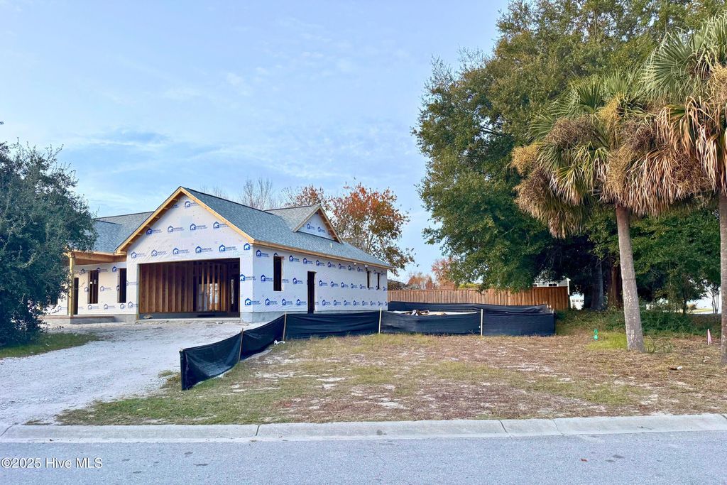 Photo of 6098 Turtlewood Drive, Southport, NC 28461 (MLS # 100543554)