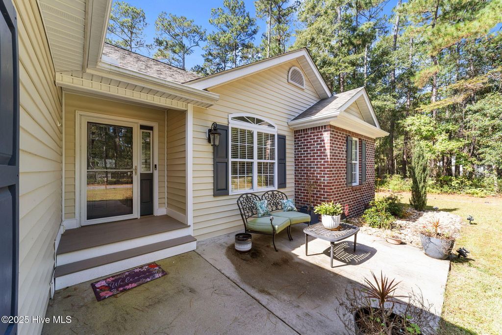 Photo of 20 Myrtlewood Drive SW, Carolina Shores, NC 28467 (MLS # 100536518)