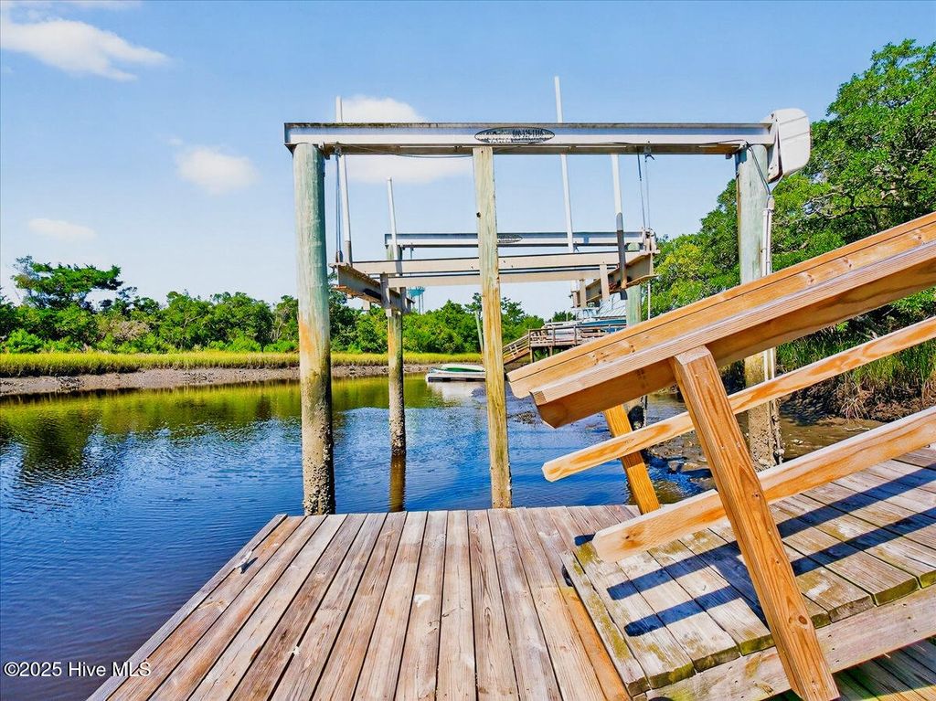 Photo of 117 SE 4th Street, Oak Island, NC 28465 (MLS # 100520195)